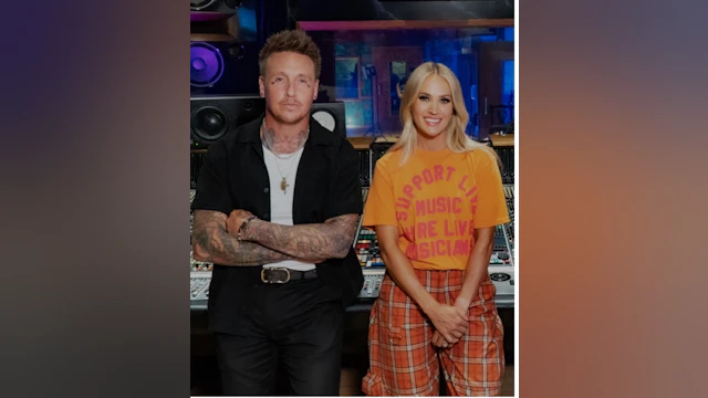 Jacoby and Carrie lean against recording equipment