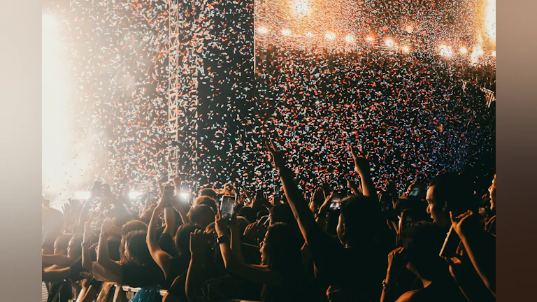 Confetti falls on concert attendees