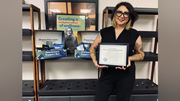 Mai holding certificate for RFW