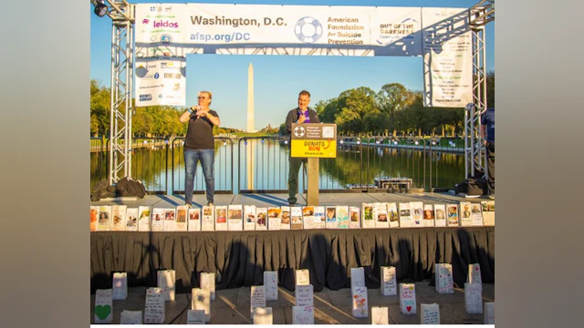 Leidos’ Director Corporate Responsibility Daniel Pellegrom speaking on the steps of the Lincoln Memorial at the 2024 Washington, D.C. Out of the Darkness Community Walk