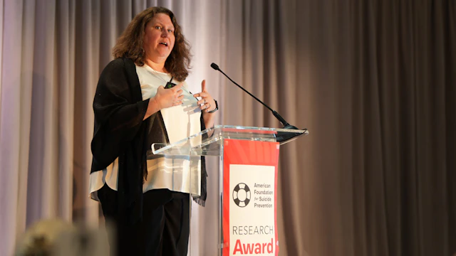 Dr. Kate Comtois presenting her research at AFSP's 2025 Research Award Dinner.