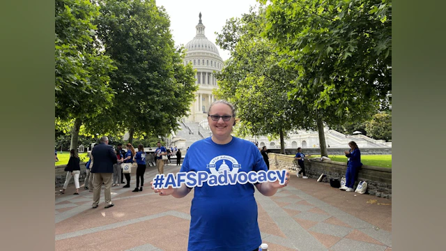 woman holding sign #afspadvocacy