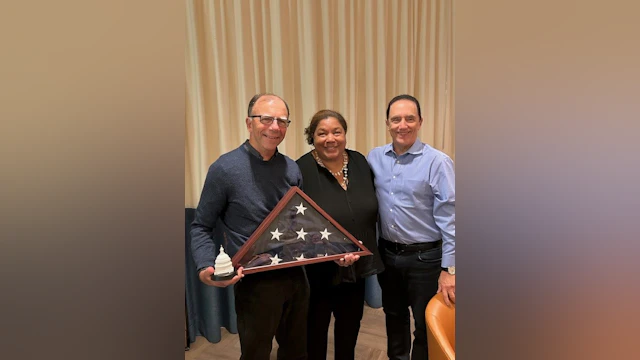 From left to right: Steve Moore, Executive Vice President and Chief Policy and Advocacy Officer Laurel Stine, and AFSP CEO Bob Gebbia. Steve is receiving the flag flown over Capitol Hill to honor his many years of advocacy for AFSP.