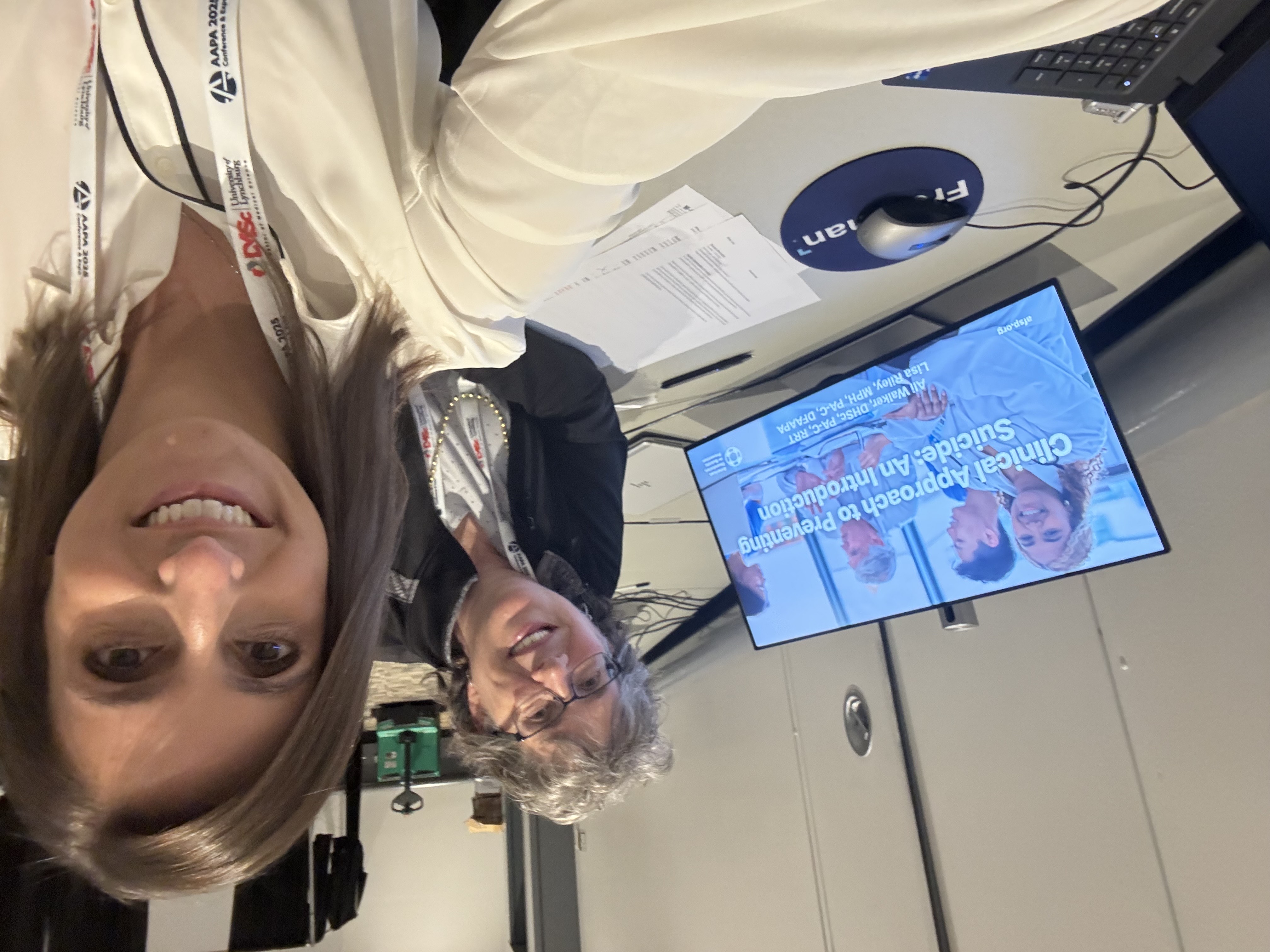 The authors, Lisa Riley and Ali Walker, sitting next to each other and smiling.