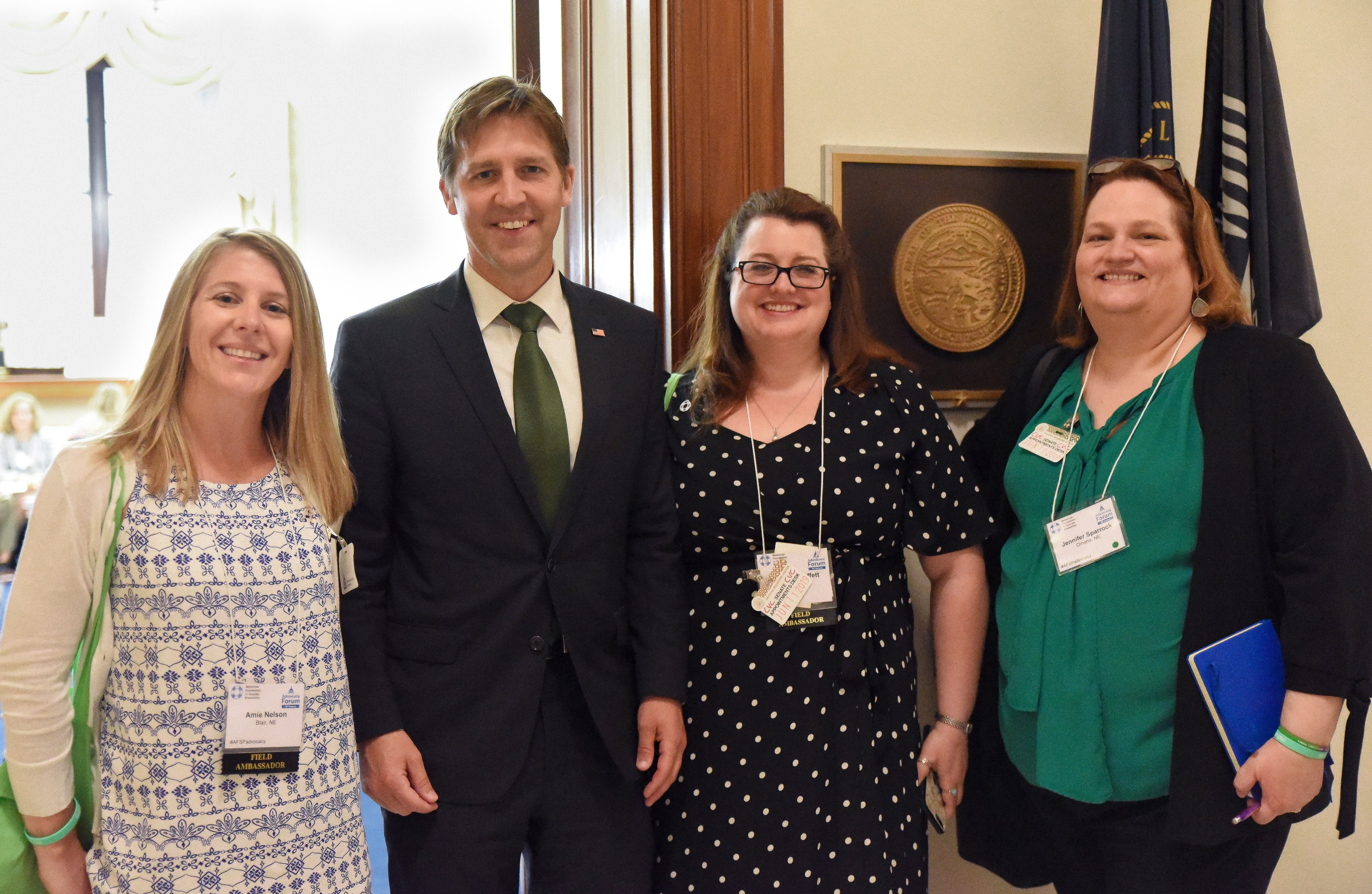 The author Jennifer Moffett meeting with a representative about AFSP's mission.