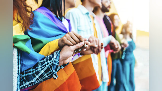 LGBTQ+ youth holding hands
