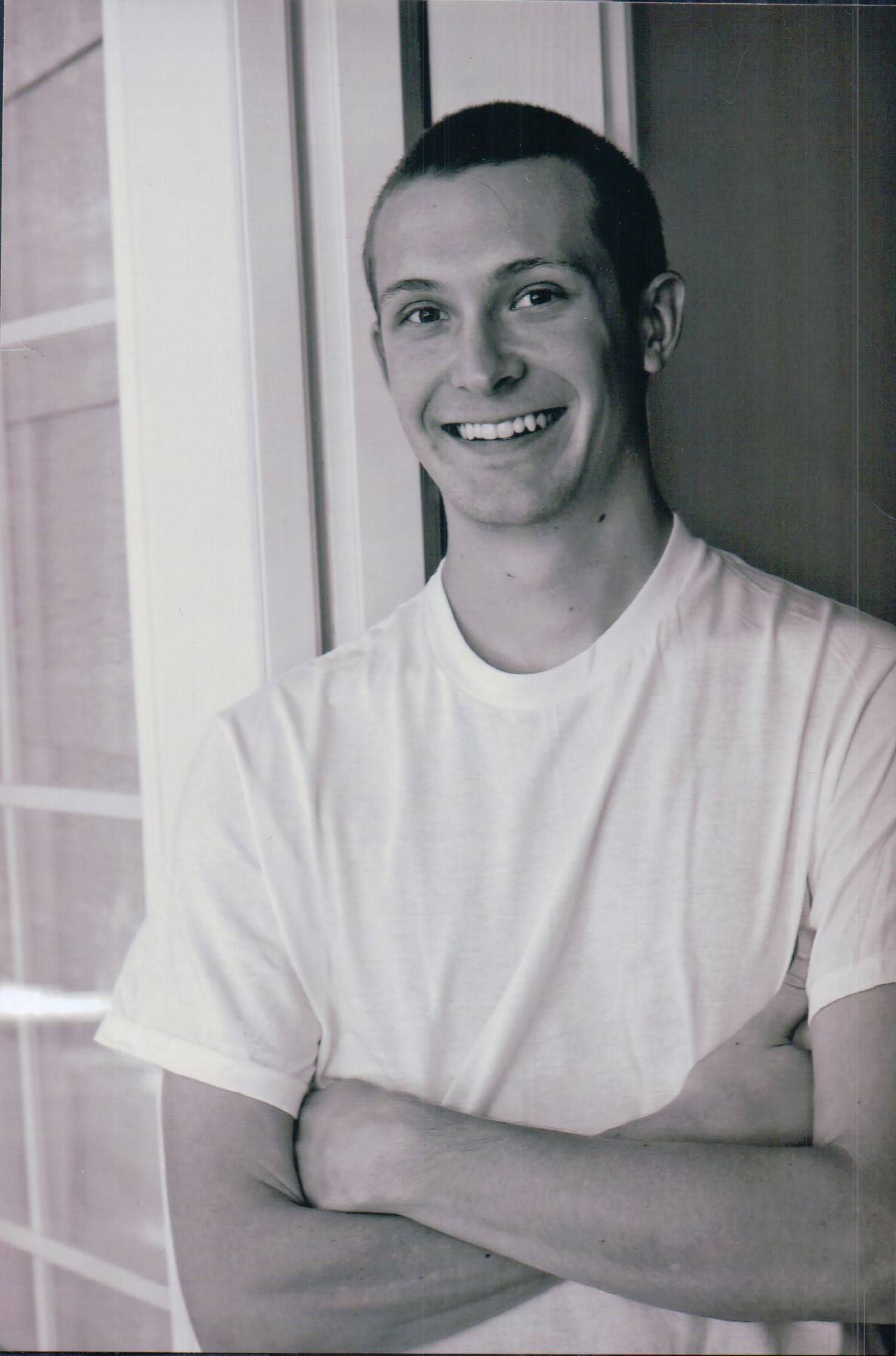 Black and white image of Karen Vaden's son Troy, smiling.