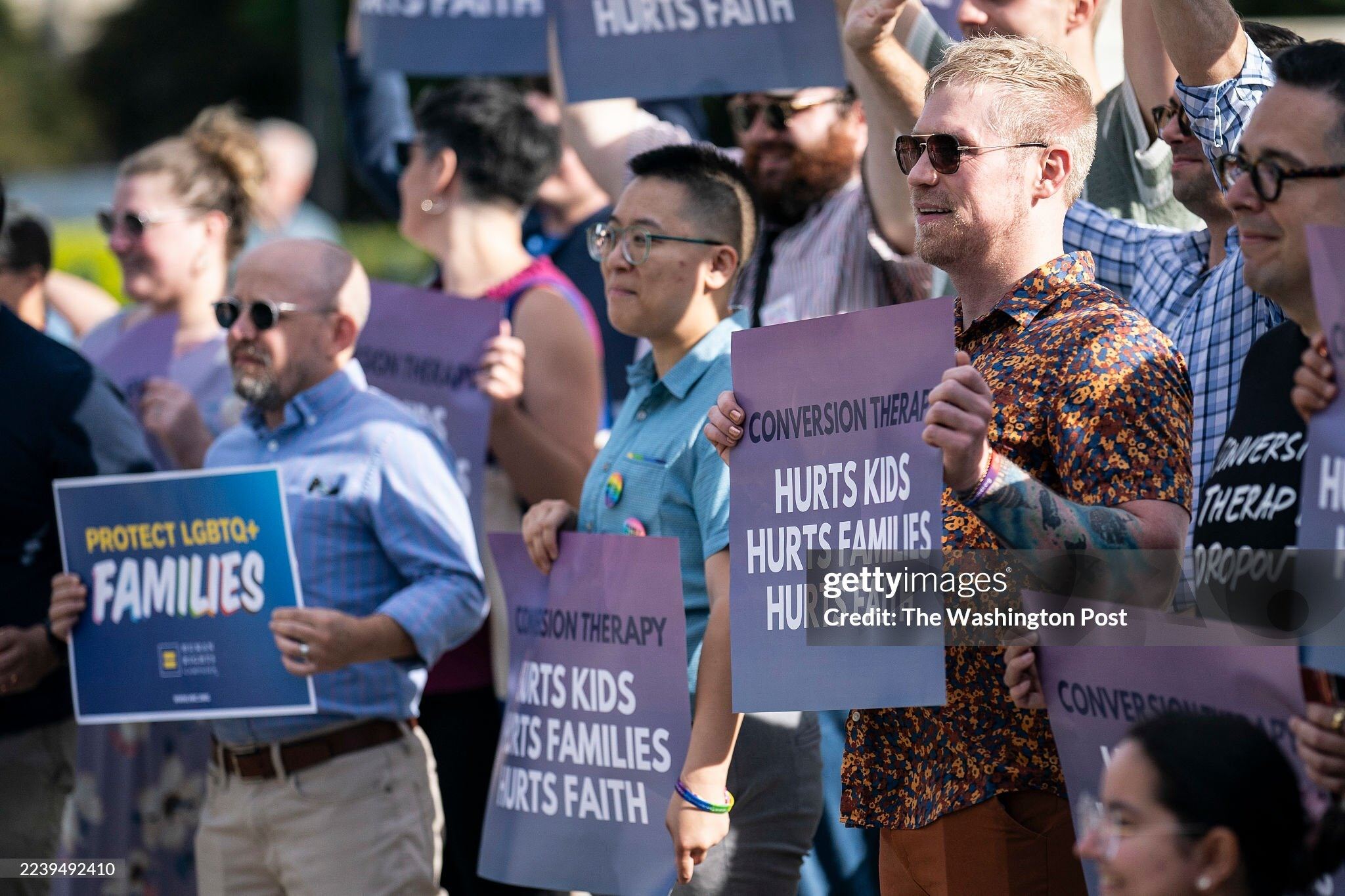 Alison Kwok (center) advocating for LGBTQ+ mental health and suicide prevention.