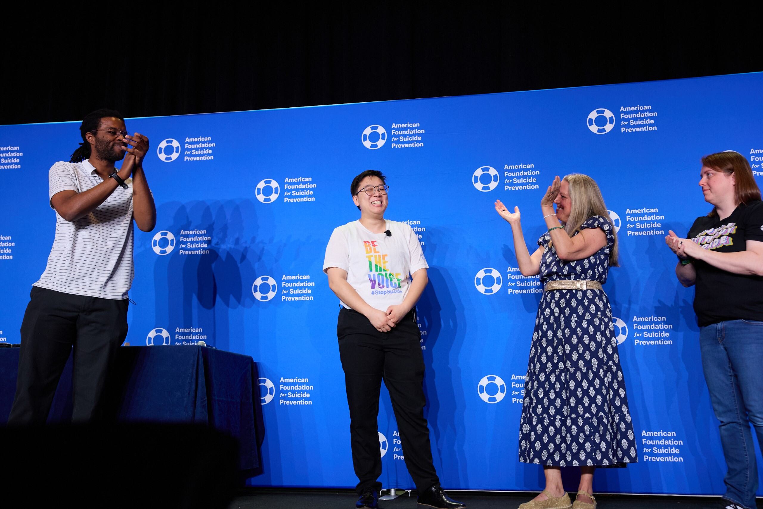 Alison Kwok on stage at the 2026 Advocacy Forum after speaking to over 200 Volunteer Advocates about their lived experience as a member of the LGBTQ+ community and as a survivor of suicide loss and personal attempts.