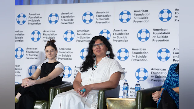 Charlie Amáyá Scott on stage during AFSP plenary session on mental health storytelling