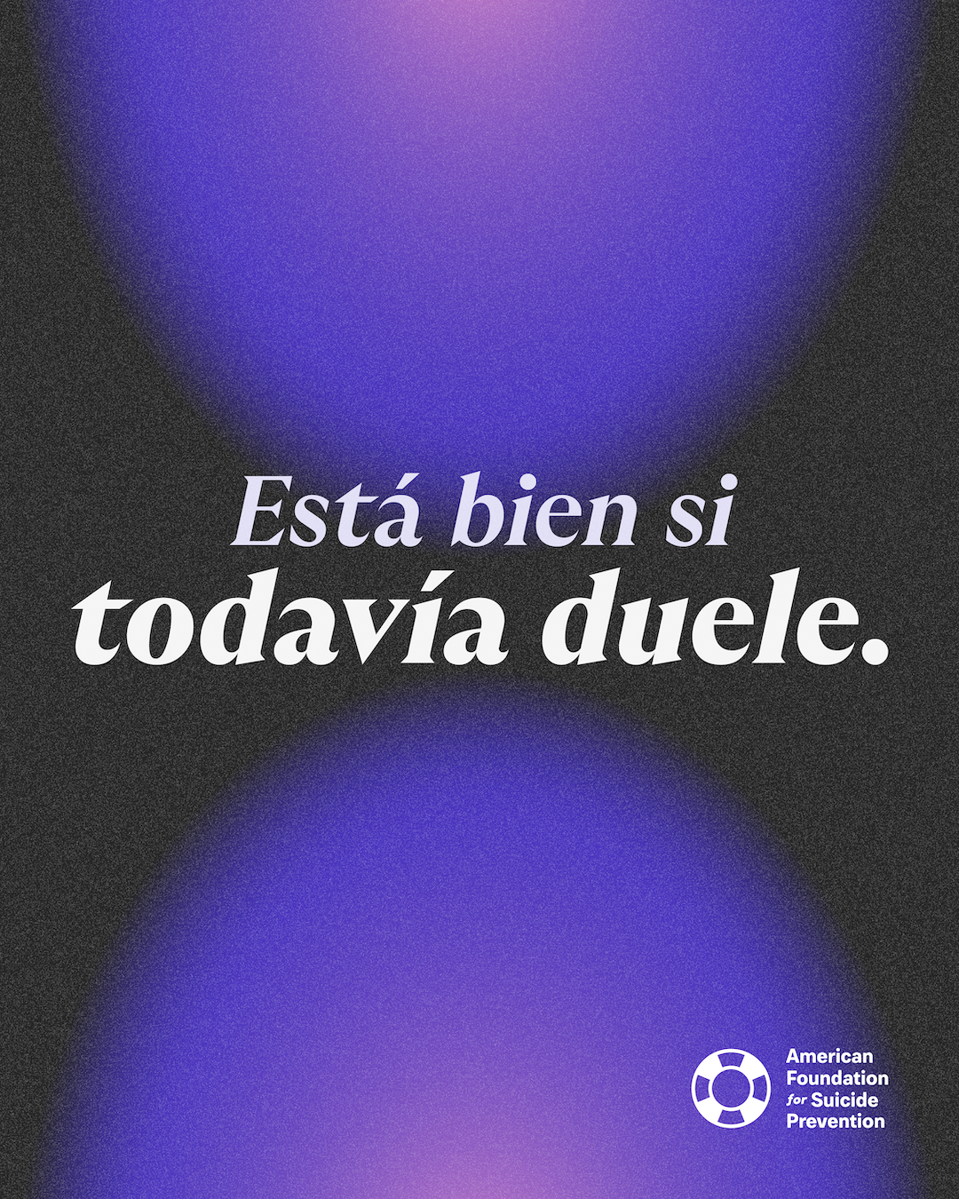 Spanish-language graphic reading “Está bien si todavía duele” (It’s okay if it still hurts). Italic serif lettering in lavender and white on a charcoal background with glowing purple orbs, and the American Foundation for Suicide Prevention logo.
