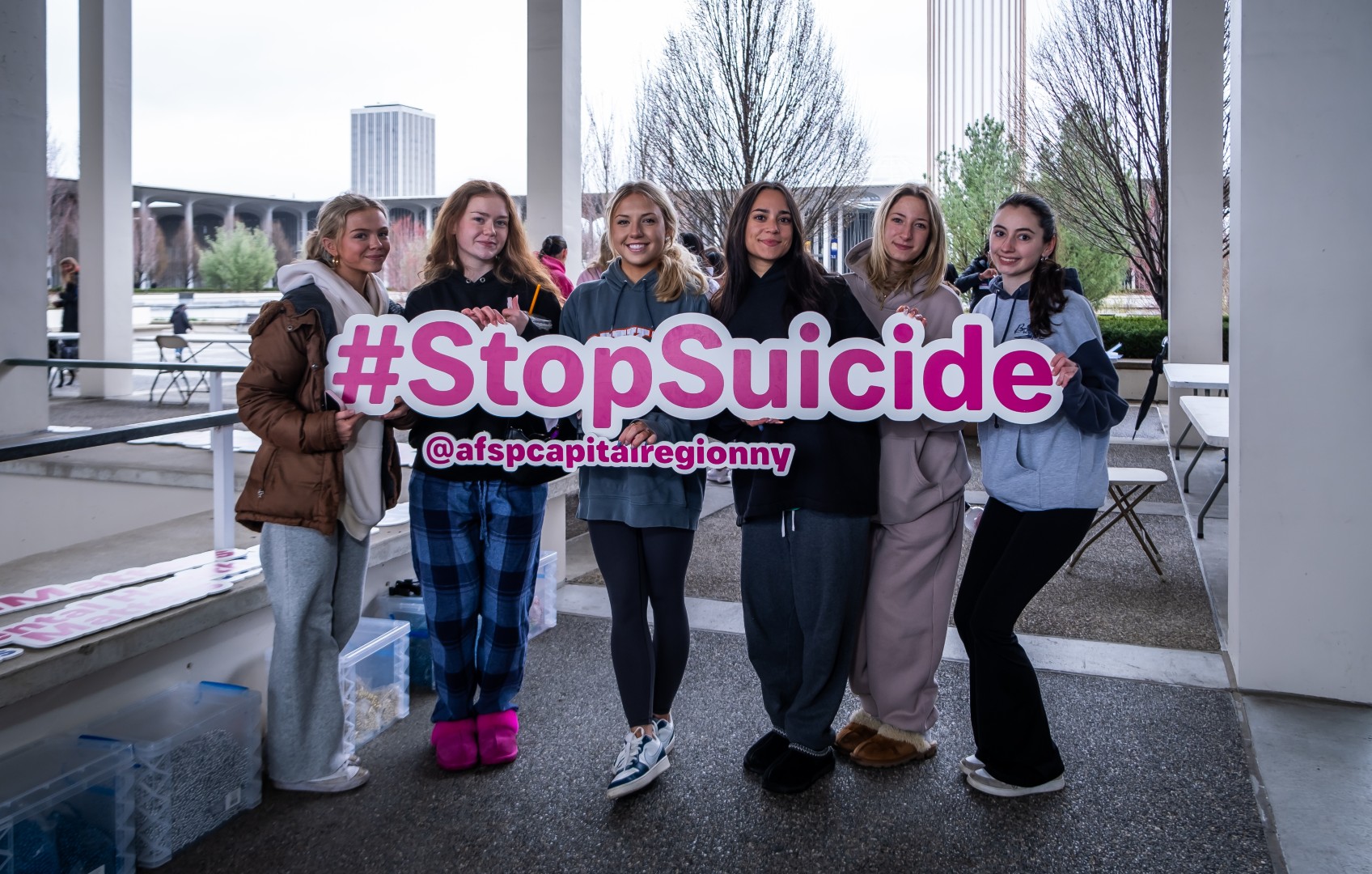 group of students holding a stop suicide sign