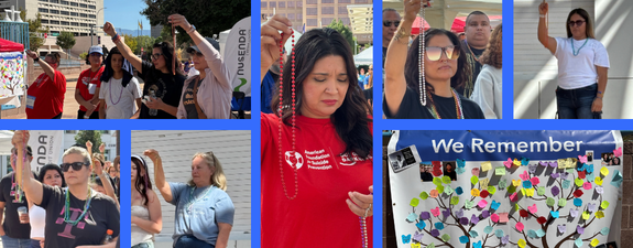 Participants raise their honor beads during the 2026 Albuquerque Out of the Darkness Walk at Civic Plaza, honoring their personal connections to suicide prevention and loss.