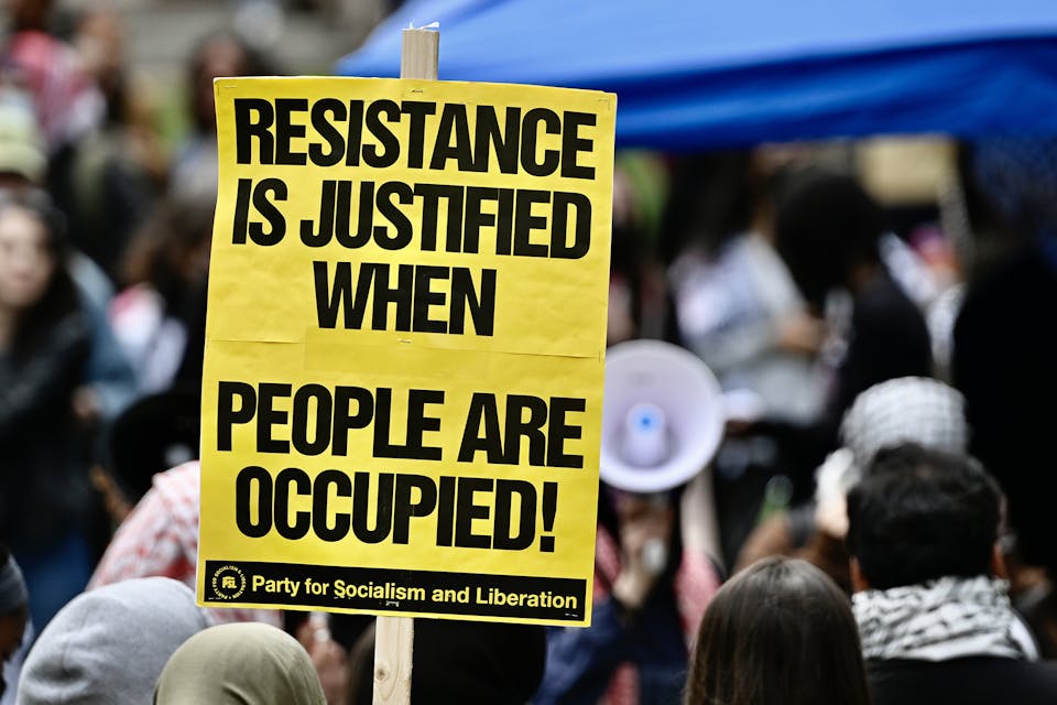 George Washington University students protesting Israel on April 25, 2024 in Washington, D.C. *Celal Gunes/Anadolu via Getty Images*. Philologos Slogans