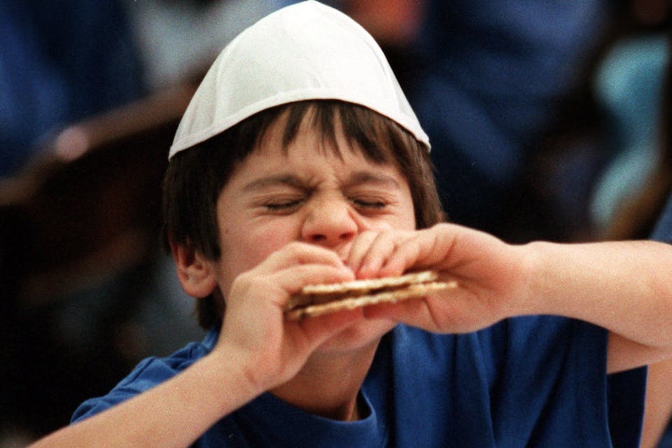 A boy in California has difficulty biting through his Hillel sandwich during a practice Passover seder in 1997. *Alex Garcia/Los Angeles Times via Getty Images.* Hillel Sandwich