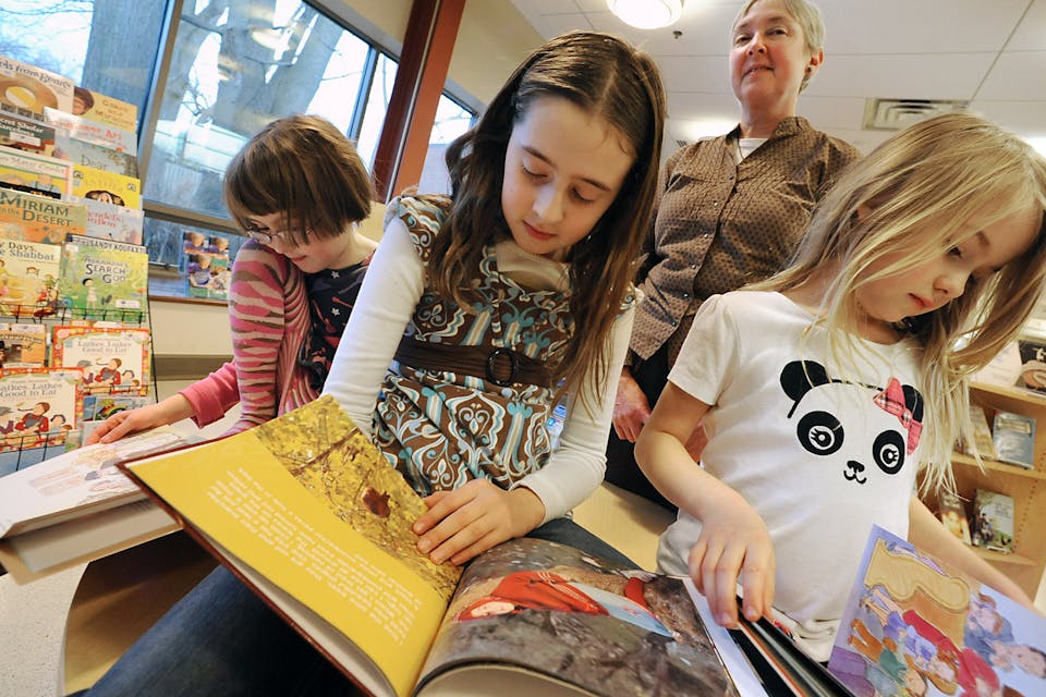 Three sisters in the new Jewish book section at the John Bach library on Friday, Dec. 9, 2011 in Albany, N.Y. *Lori Van Buren/Albany Times Union via Getty Images*. Carney Podcast