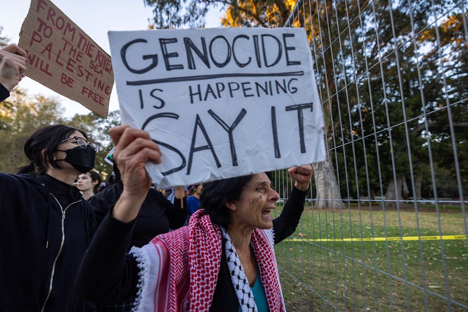 Protesters denounce the Biden administration's support of Israel on December 8, 2023 in Los Angeles. *David McNew/Getty Images.* Mor Dictionary Main