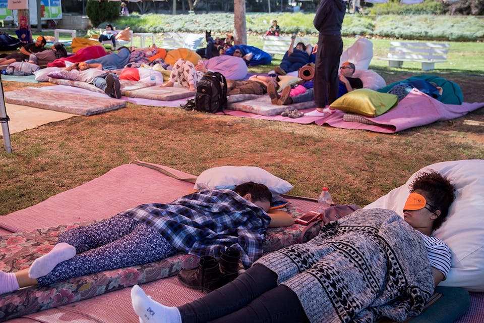 People sleep during a public napping event in central Jerusalem on November 2, 2018. *Yonatan Sindel/Flash90*. Phil Snooze