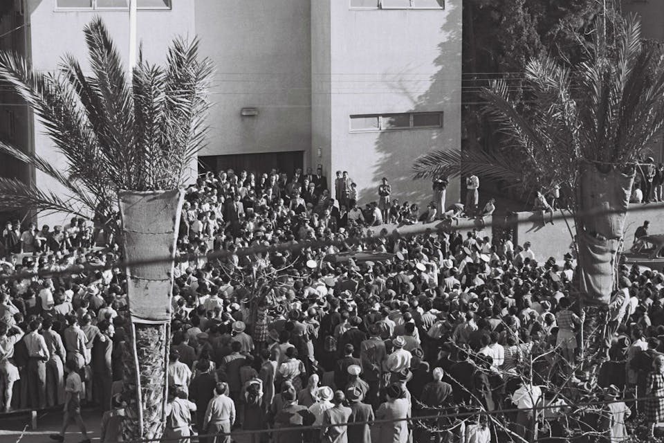 *Crowds await Israel’s Declaration of Independence, written with the help of an American Jew.* Independence Hall/Beit Haatzmaut Museum. Israeli Declaration