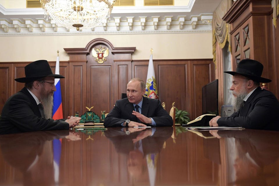 Vladimir Putin speaks with Berel Lazar, the chief rabbi of Russia, and Alexander Boroda, head of the Jewish Communities' Federation, in Moscow in 2016.* ALEXEI DRUZHININ/AFP via Getty Images.* Shrayer-Main