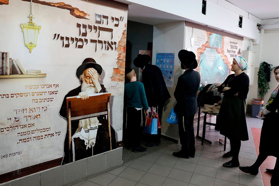 Haredi voters on April 9, 2019 in the Israeli city of Bnei Brak. *AHMAD GHARABLI/AFP via Getty Images*. Spitzer Voting