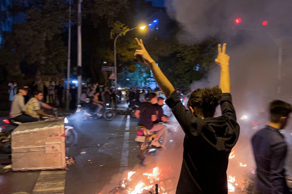 Protesters in Tehran on September 19, 2022. *Stringer/Anadolu Agency via Getty Images.* Iran Protests Main