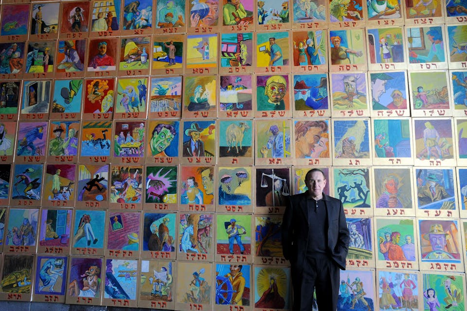 Archie Rand in front of his 613 series in a warehouse in Brooklyn in 2008. *Todd Maisel/NY Daily News Archive via Getty Images.* Rand Main