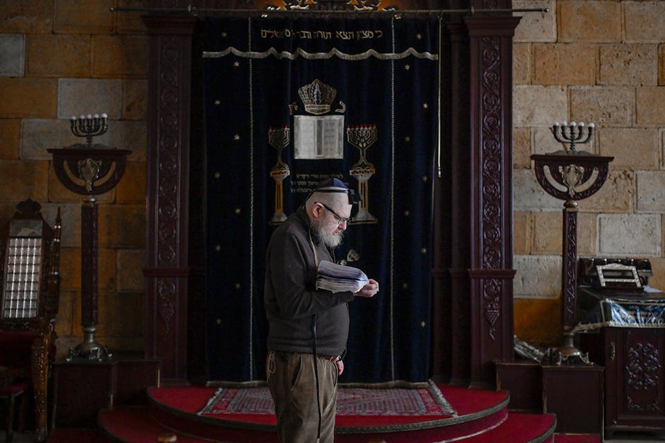 A Jewish man prays in the Chabad Synagogue in Odessa on March 9, 2022. *BULENT KILIC/AFP via Getty Images*. Odessa Dubnov Main