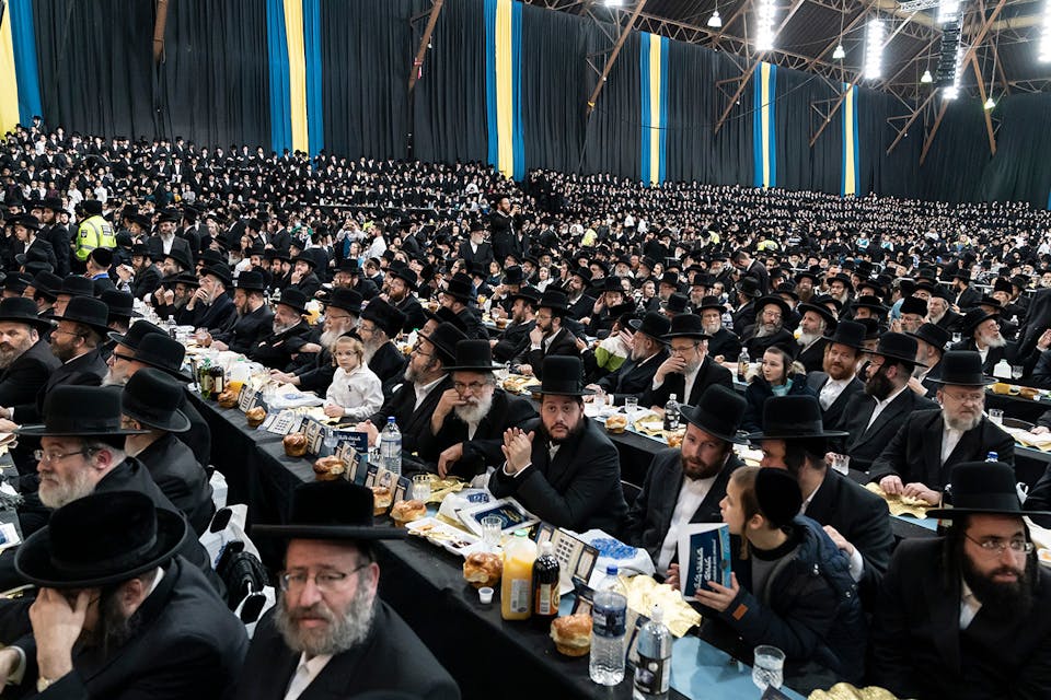 A celebration on the anniversary of the escape from Hungary in 1944 of Rabbi Joel Teitelbaum, the first Satmar *rebbe*. *Lev Radin/Pacific Press/LightRocket via Getty Images.* Spitzer Satmar