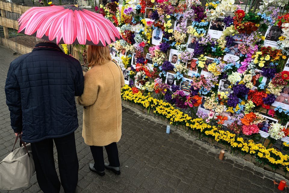 A floral memorial wall for Ukrainian civilians killed during the Russian invasion on April 24, 2022 in Lviv, Ukraine. *Leon Neal/Getty Images*. Mandel Main