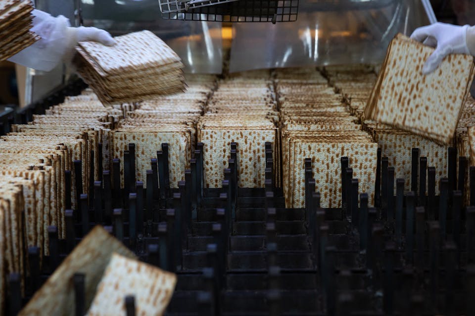 Workers making matzah for Passover in Bnei Brak, Israel in 2020. *Guy Prives/Getty Images.* UnderDot