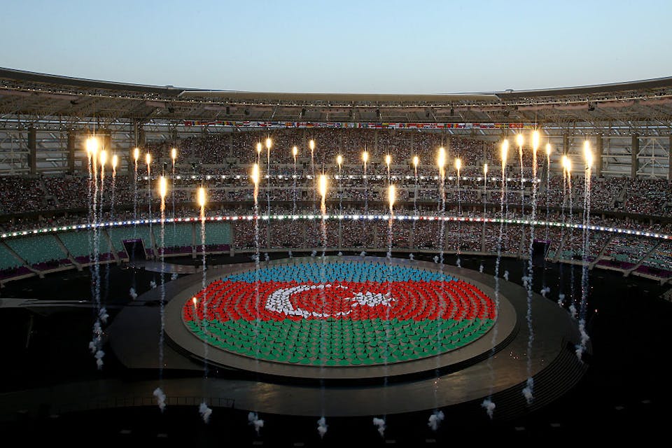 Performers depict the national flag of Azerbaijan during the opening ceremony for the 2015 European Games on June 12, 2015 in Baku, Azerbaijan. *Photo by Richard Heathcote/Getty Images for BEGOC.* BAKU, AZERBAIJAN – JUNE 12: Performers depict the national flag of Azerbaijan during the Opening Ceremony for the Baku 2015 European Games at the Olympic Stadium on June 12, 2015 in Baku, Azerbaijan. (Photo by Richard Heathcote/Getty Images for BEGOC)