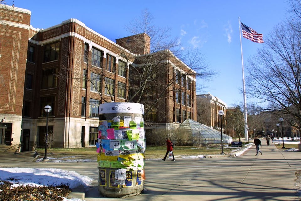 Students walk across the University of Michigan campus on January 17, 2003 in Ann Arbor, Michigan. *Photo by Bill Pugliano via Getty Images. * Greene-Main
