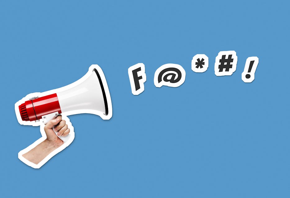 Hand holding megaphone on blue background with swear and curse symbols. Collage cut out style illustration