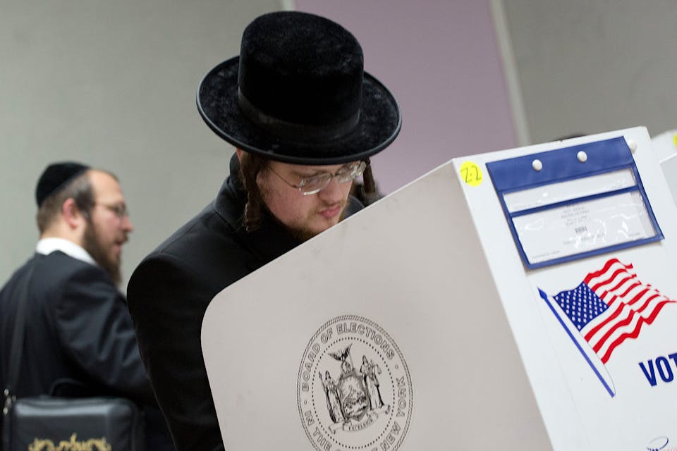 Jewish voters marking their ballots on November 8, 2016, in Brooklyn. *AP Photo/Mark Lennihan*. Haredi Vote Main