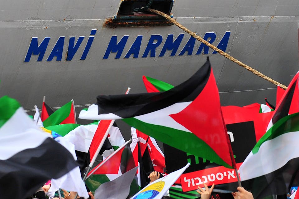 The Turkish ship *Mavi Marmara* arrives at Istanbul's Sarayburnu port as people wave Turkish and Palestinian flags on December 26, 2010. *MUSTAFA OZER/AFP via Getty Images*. Navon Main