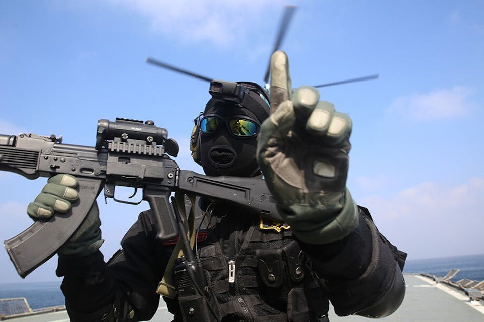 A member of the Iranian navy at a military exercise in the Arabian Sea on February 17, 2021. *Iranian Army/Handout/Anadolu Agency via Getty Images.* Orion Takeyh Iran Main