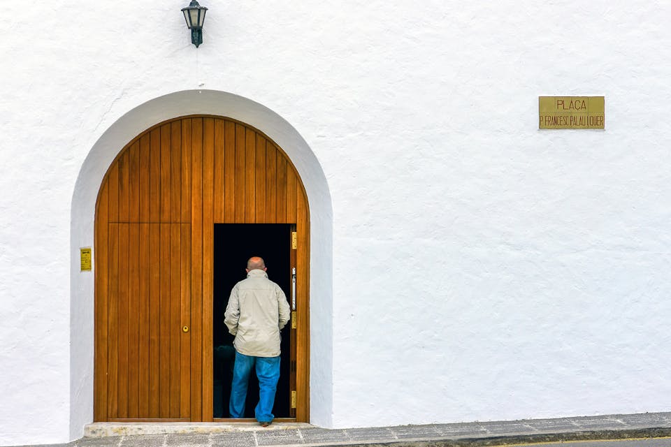 A man going to Mass at a church on the Balearic Islands in Spain. *M. Vinuesa/Shutterstock*. Spanish Church