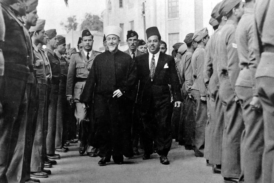 Amin al-Husseini, then-Grand Mufti of Jerusalem, reviewing a guard formation in the Galilee on April 23, 1947. *Universal History Archive/Universal Images Group via Getty Images.* Mufti Main