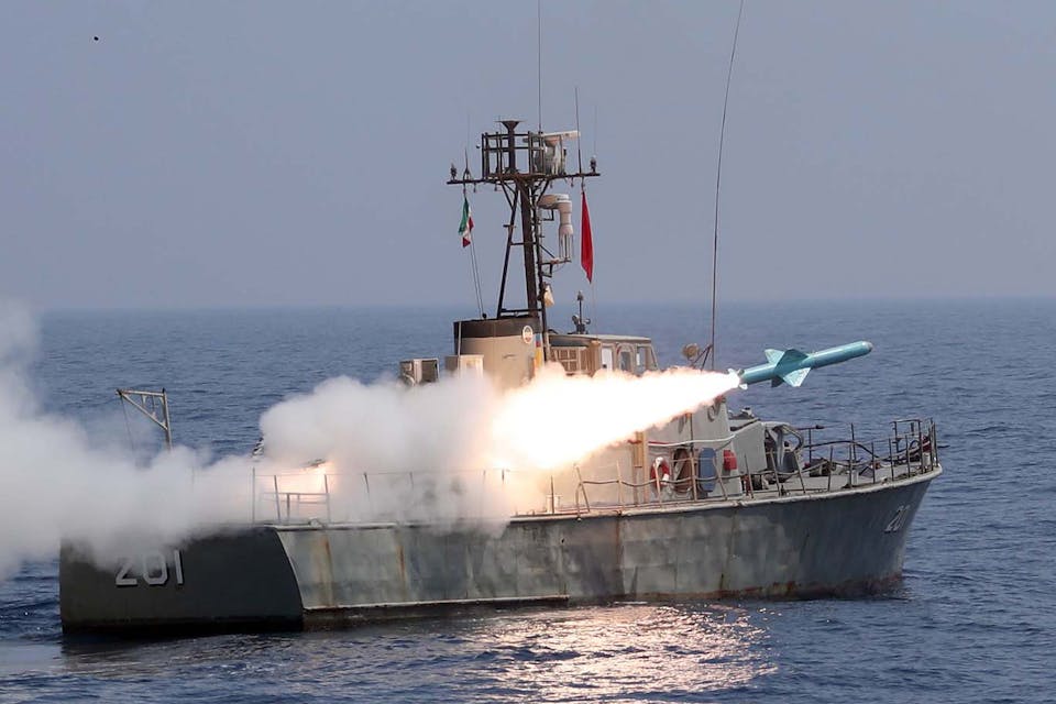 A missile being fired from an Iranian warship during the second day of a military exercise in the Gulf near the strategic strait of Hormuz in southern Iran. *Iranian Army office/AFP via Getty Images.* Goldberg July 2021 Main