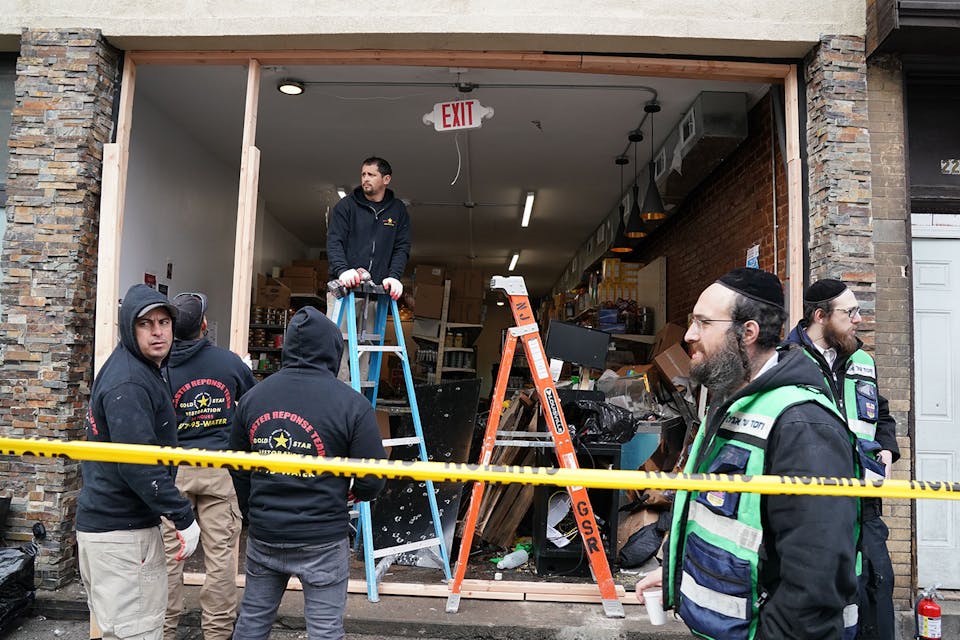 Demolition and recovery crews at the scene of the December 10, 2019 shooting at a Jewish deli in Jersey City, New Jersey. *BRYAN R. SMITH/Afp/AFP via Getty Images*. Wisse Ranking Main