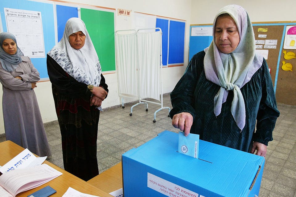 An Israeli Arab woman votes in 2003 in the village of Jaljuliya. *David Silverman/Getty Images*. Israeli Arab Etc Main