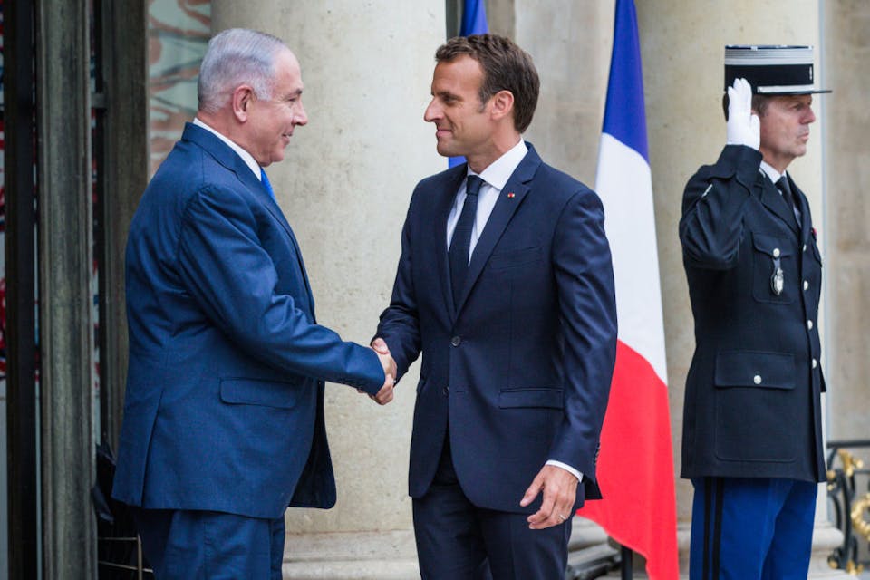 PARIS, FRANCE – JUNE 05:  French President Emmanuel Macron (R) welcomes the Israeli Prime Minister Benyamin Netanyahou for a meeting and a press conference at Elysee Palace on June 5, 2018 in Paris, France. After meeting Angela Merkel in Berlin on Monday, Benyamin Netanyahu is continuing his offensive in Paris to try to create a common front against Iran.  (Photo by Aurelien Morissard/IP3/Getty Images)