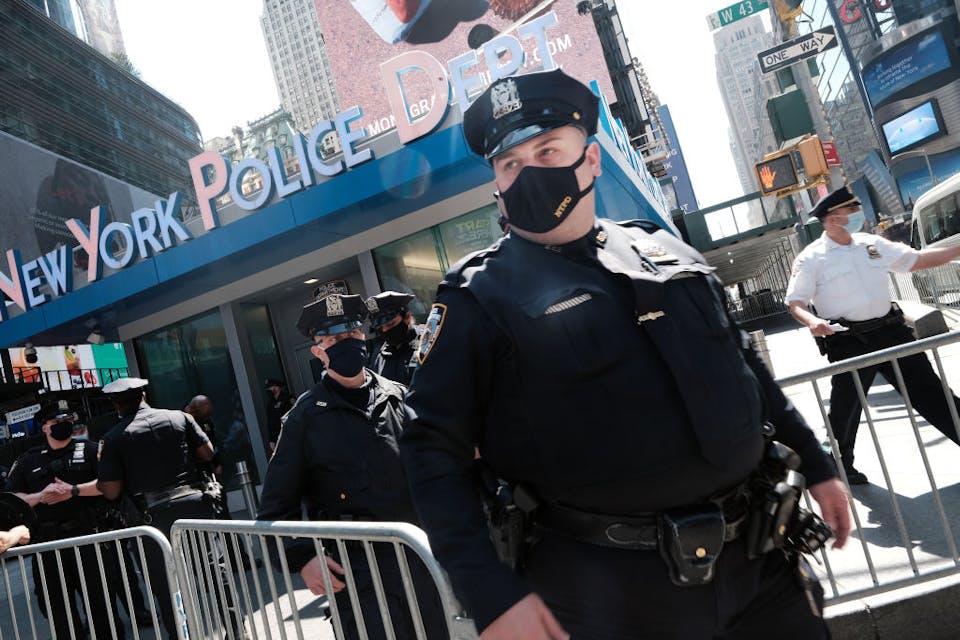 NEW YORK, NEW YORK – APRIL 20: Members of the NYPD congregate in Times Square near a police precinct for a security briefing as security throughout the city is increased ahead of a verdict in the Derek Chauvin trial on April 20, 2021 in New York City. Across the nation and world, people are waiting for the verdict  in the trial in which the former Minneapolis police officer kneeled on the neck of George Floyd and is on trial for killing him. Demonstrations erupted around the world following Floyd’s death.  (Photo by Spencer Platt/Getty Images)