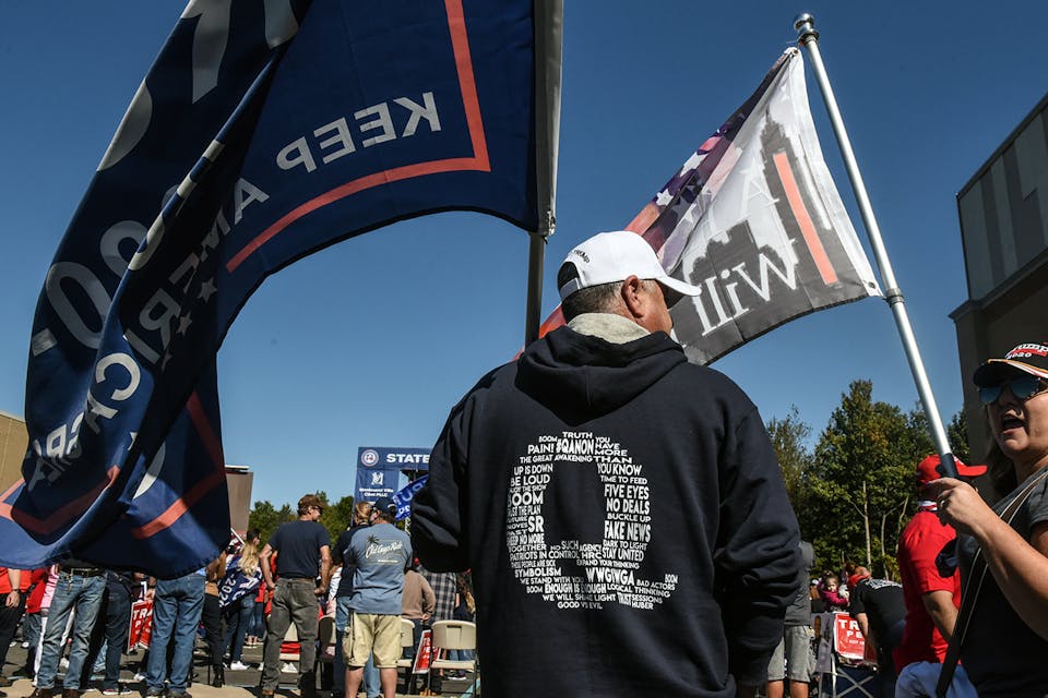A person wears a QAnon sweatshirt during a pro-Trump rally on October 3, 2020 in the borough of Staten Island in New York City. *Stephanie Keith/Getty Images*. QAnon Main