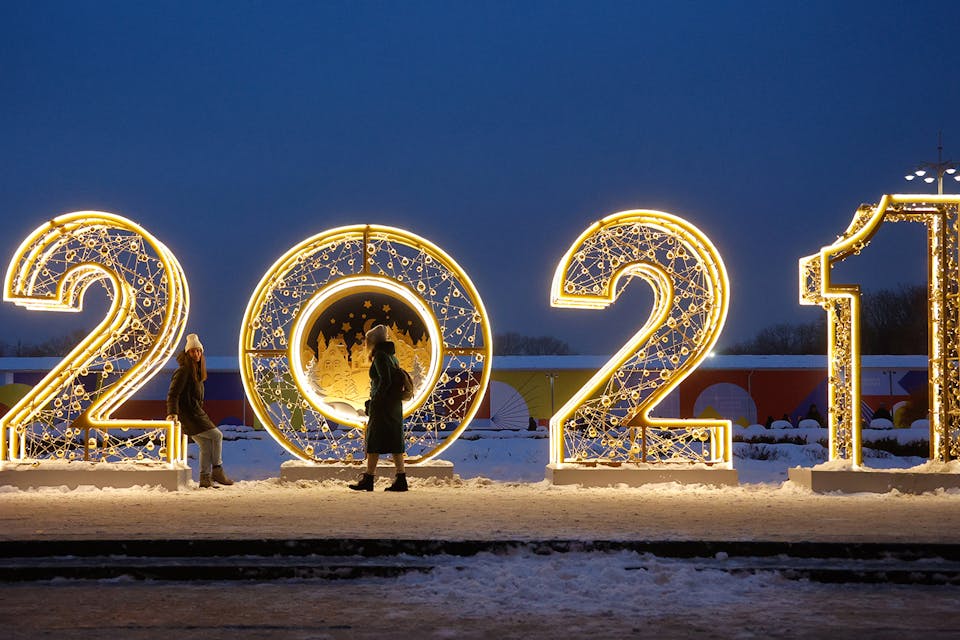 Two women at a light installation in Moscow's Gorky Park on January 7, 2021. *Valery Sharifulin/TASS via Getty Images*. Calendar Main