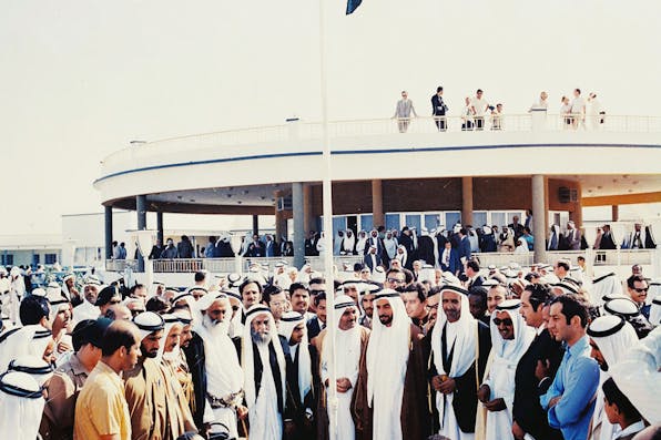 The first hoisting of the flag of the United Arab Emirates at the Union House in Dubai on December 2, 1971. *Wikipedia.* Flag-hoisting_at_the_Union_Declaration