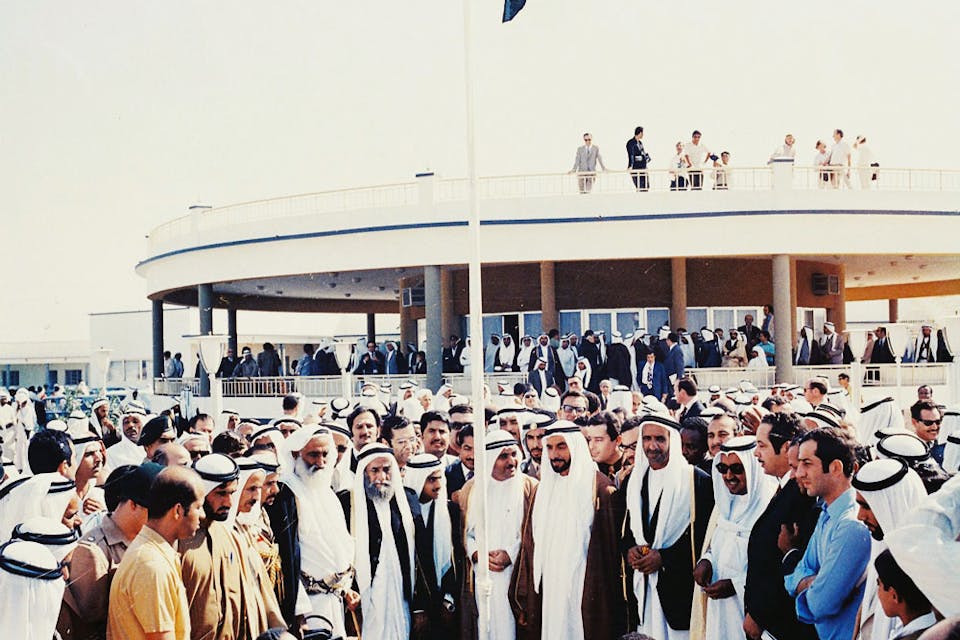 The first hoisting of the flag of the United Arab Emirates at the Union House in Dubai on December 2, 1971. *Wikipedia.* Flag-hoisting_at_the_Union_Declaration
