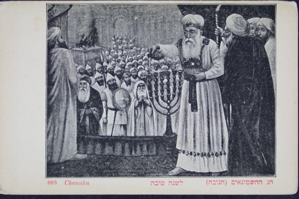 A Hanukkah illustration from a file of cards found in the National Library of Israel. *Wikimedia.* 20200930094420!The_National_Library_of_Israel,_Jewish_New_Year_cards_C_HL_12