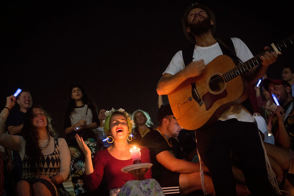 *Young Israeli Jews sing at a Havdalah ceremony in Tel Aviv on October 24, 2015.* Miriam Alster/FLASH90. IsraeliJudaism Main